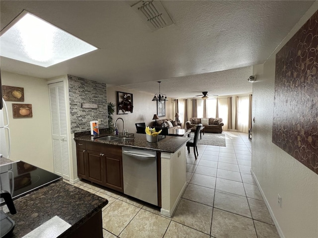 2494 Sweetwater Club Cir Unit 55, Kissimmee, FL 34746 - kitchen featuring a textured ceiling, ceiling fan, a sink, open floor plan, and stainless steel dishwasher