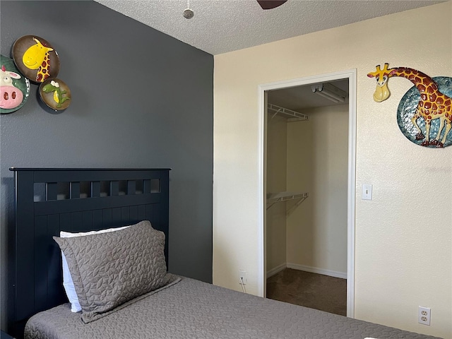 2494 Sweetwater Club Cir Unit 55, Kissimmee, FL 34746 - carpeted bedroom with a spacious closet and a textured ceiling