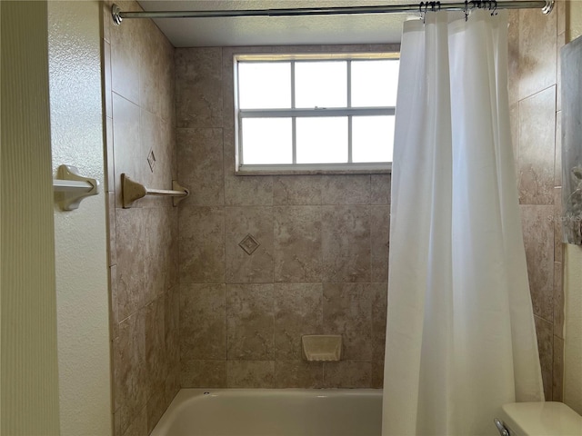 2494 Sweetwater Club Cir Unit 55, Kissimmee, FL 34746 - bathroom featuring shower / bath combo and toilet