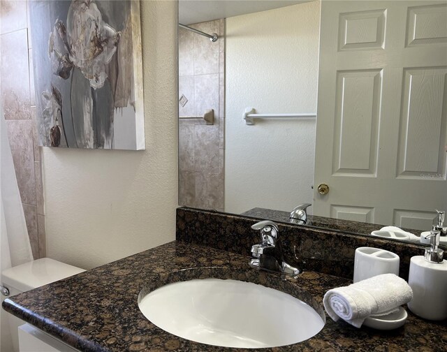 2494 Sweetwater Club Cir Unit 55, Kissimmee, FL 34746 - full bath with a shower, a textured wall, and vanity