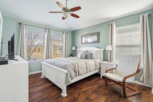 bedroom with ceiling fan, baseboards, and dark wood-style flooring