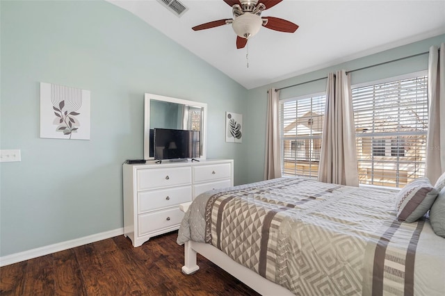 bedroom with lofted ceiling, dark wood-style flooring, a ceiling fan, visible vents, and baseboards