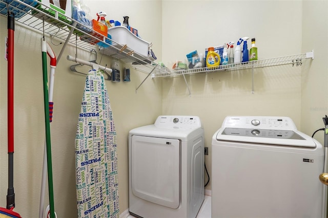 clothes washing area featuring laundry area and washer and dryer