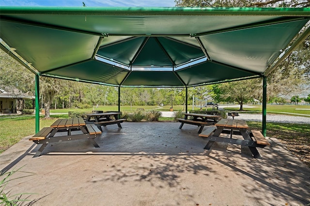 view of property's community featuring a patio area and a yard