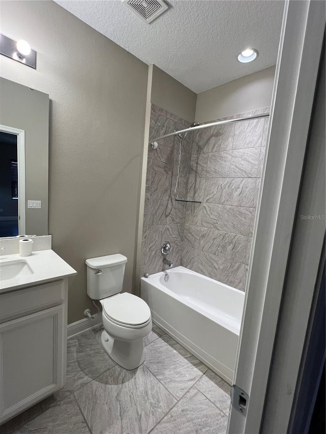 full bath featuring a textured ceiling, toilet, bathing tub / shower combination, vanity, and visible vents