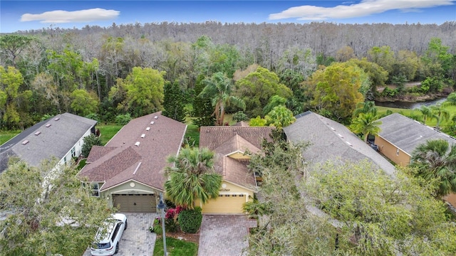 drone / aerial view with a view of trees