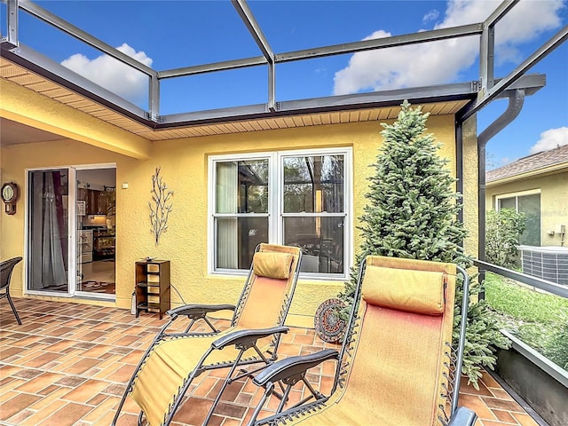 view of patio with a lanai