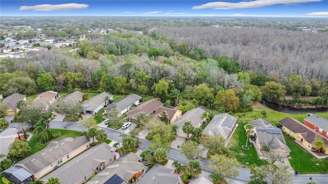 aerial view with a residential view and a view of trees