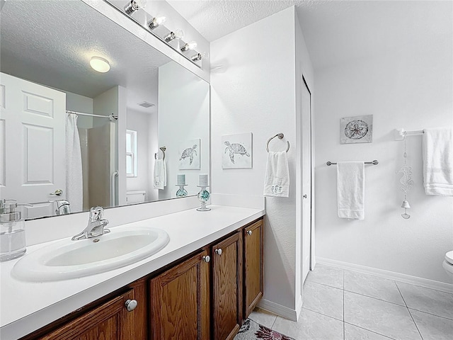 bathroom featuring a shower with shower curtain, toilet, tile patterned flooring, a textured ceiling, and vanity