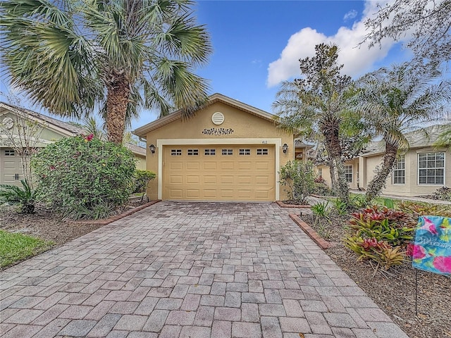 garage featuring decorative driveway