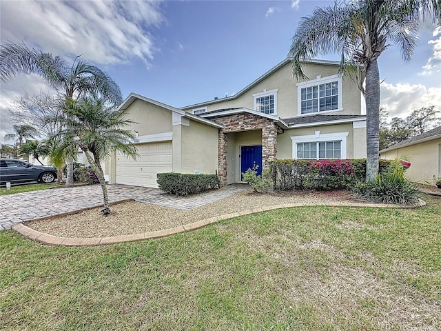 traditional-style home with decorative driveway, stucco siding, a garage, stone siding, and a front lawn