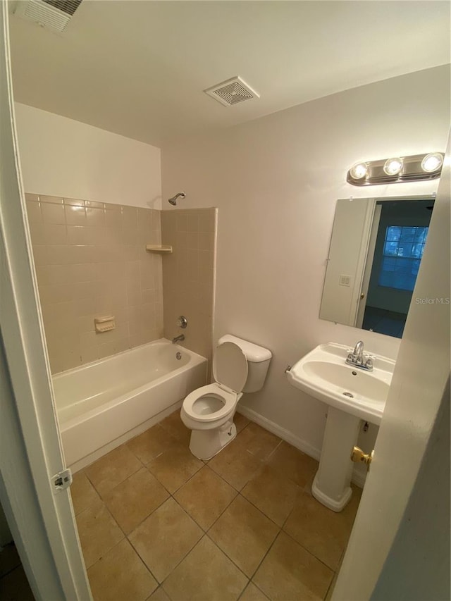 bathroom with toilet, shower / washtub combination, tile patterned flooring, and visible vents