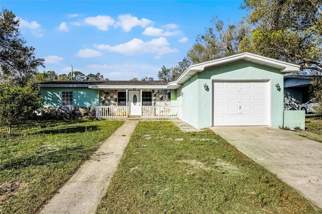 ranch-style house with a garage, concrete driveway, covered porch, a front yard, and stucco siding