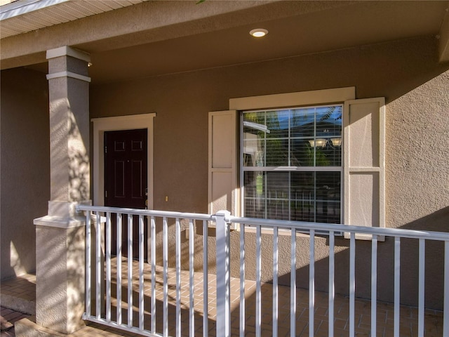 view of exterior entry with stucco siding