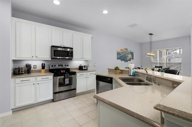 kitchen featuring white cabinets, visible vents, appliances with stainless steel finishes, and a sink