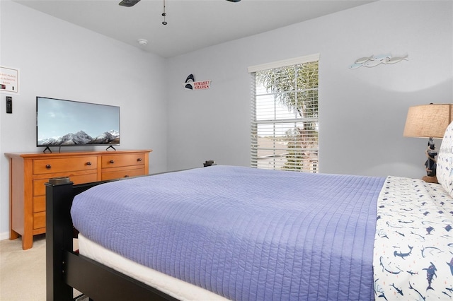 bedroom featuring light colored carpet and ceiling fan