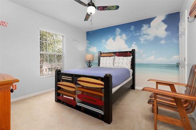 bedroom featuring ceiling fan, baseboards, and carpet