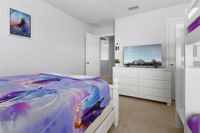 bedroom with visible vents and carpet