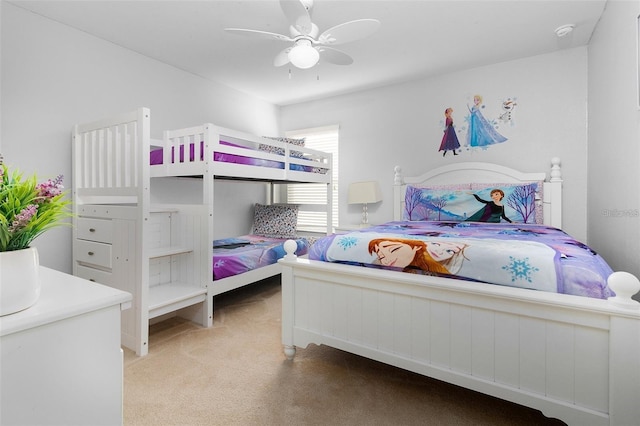 carpeted bedroom with a ceiling fan