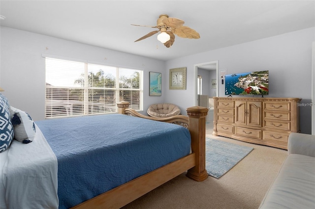 bedroom featuring light colored carpet and a ceiling fan