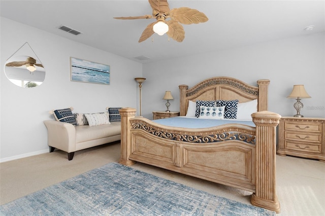 bedroom with visible vents, baseboards, light colored carpet, and a ceiling fan