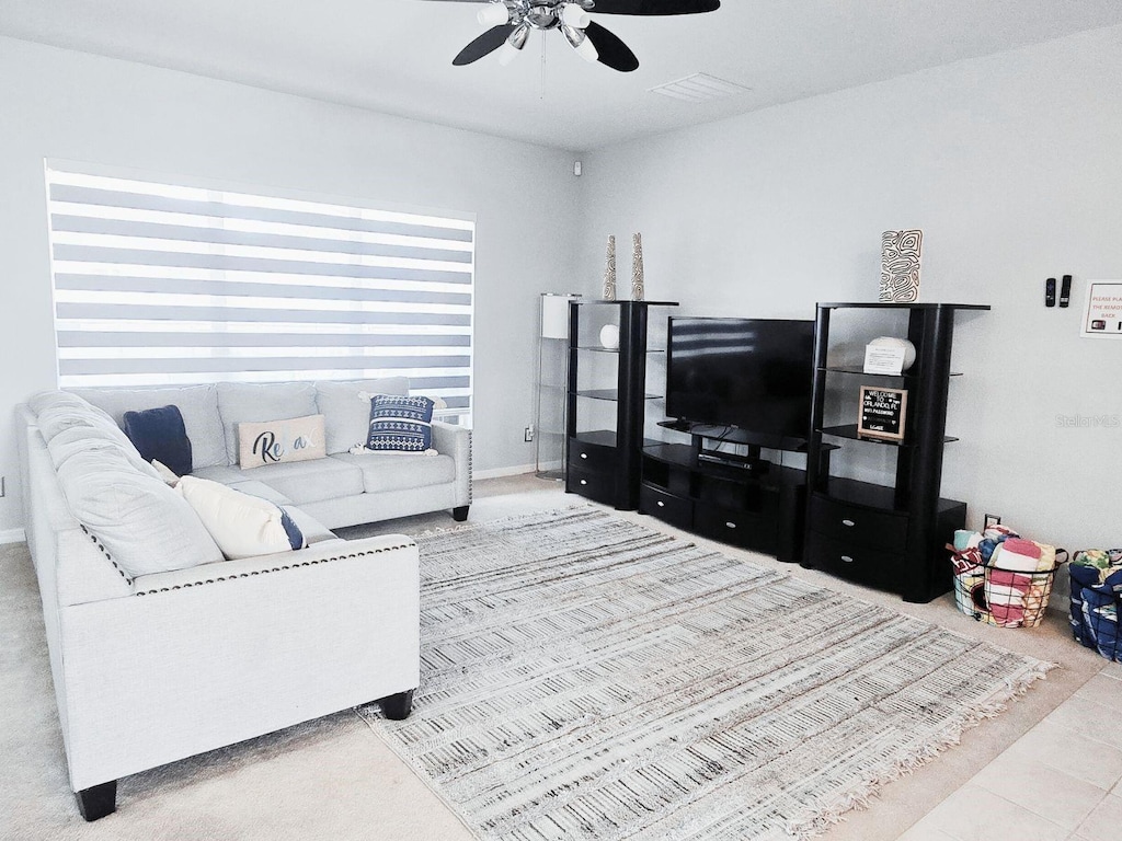 2663 Sand Hill Point Cir, Davenport, FL 33837 - tiled living area with ceiling fan