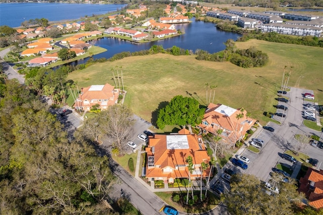 aerial view featuring a residential view and a water view