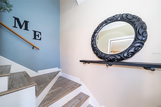 stairs featuring baseboards