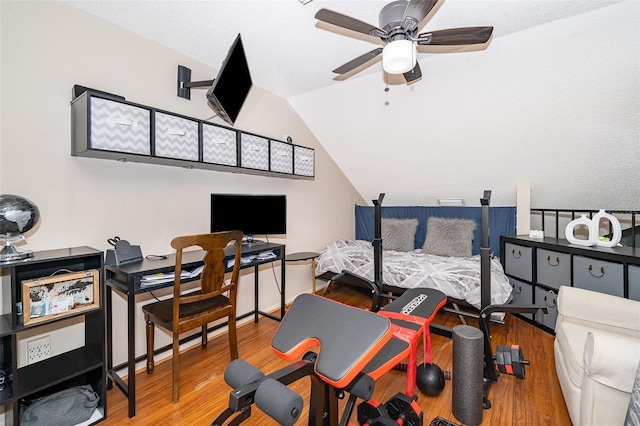 office with lofted ceiling, wood finished floors, and a ceiling fan