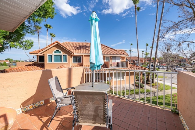 view of patio featuring a balcony