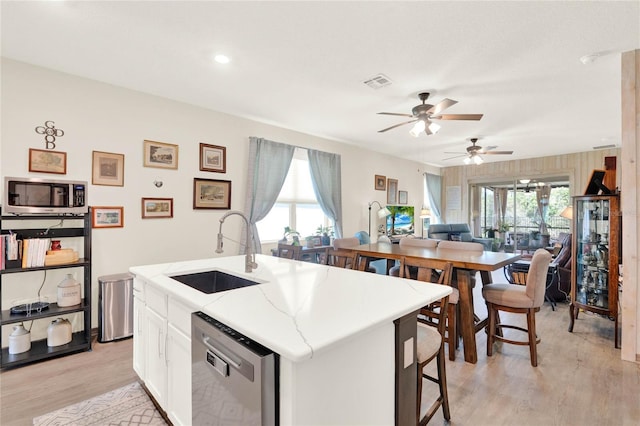 kitchen featuring plenty of natural light, visible vents, appliances with stainless steel finishes, and a sink