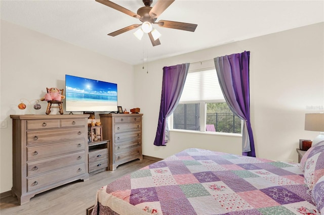 bedroom featuring a ceiling fan and wood finished floors