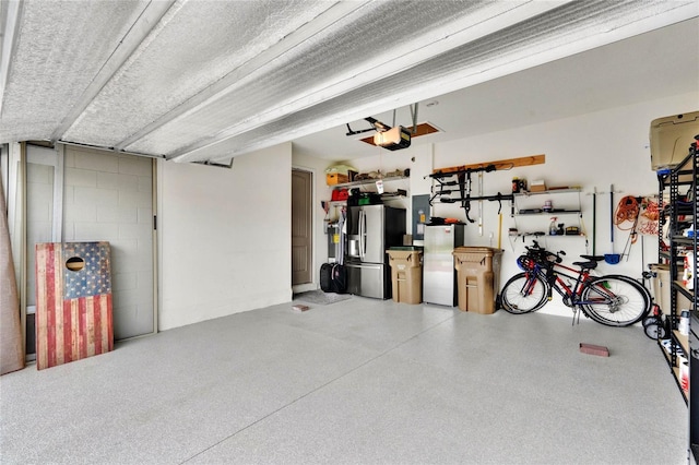 garage with concrete block wall, a garage door opener, and stainless steel fridge with ice dispenser