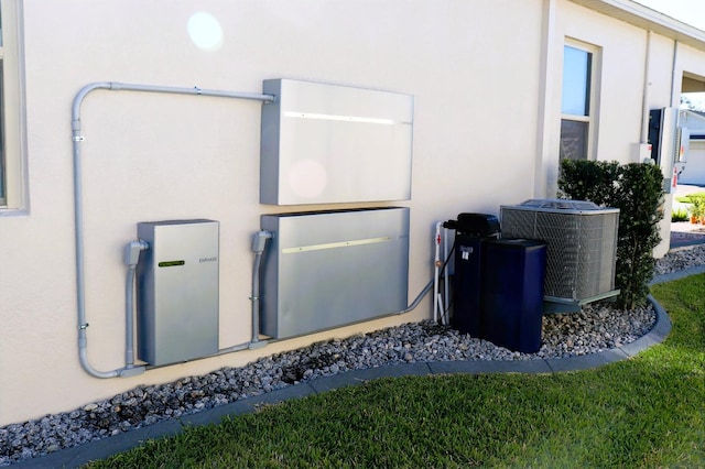 exterior space featuring central AC unit and stucco siding