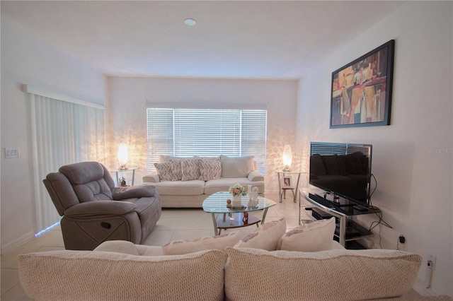 living room with baseboards and tile patterned floors