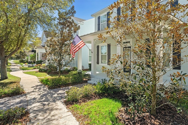 exterior space featuring a porch and stucco siding