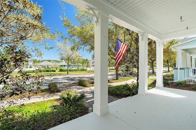 view of patio with covered porch and a residential view