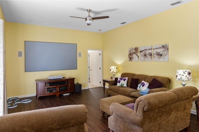 living room with a ceiling fan, wood finished floors, visible vents, and baseboards