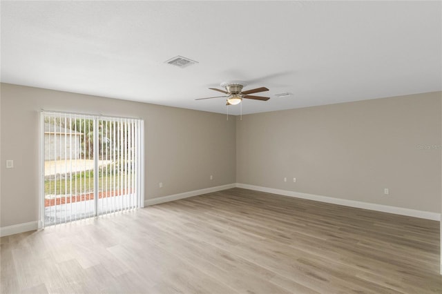 unfurnished room with baseboards, ceiling fan, visible vents, and light wood finished floors