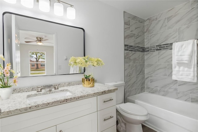 full bathroom featuring ceiling fan, vanity, toilet, and shower / bathing tub combination