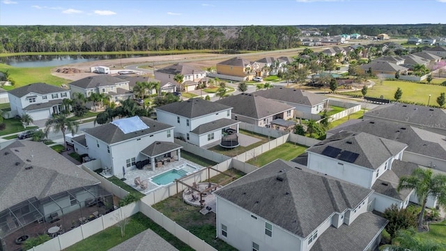 bird's eye view with a water view and a residential view