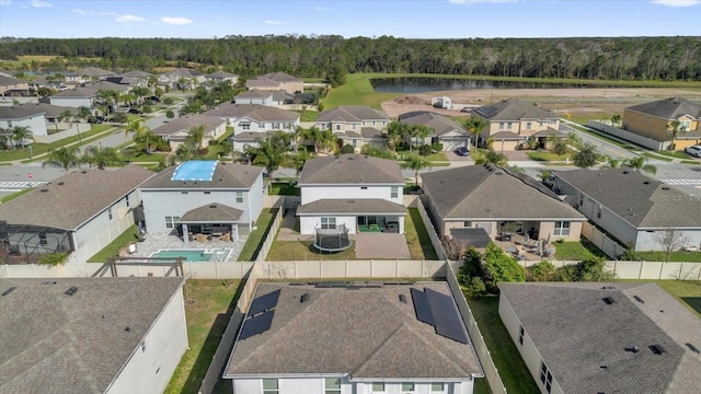 birds eye view of property featuring a residential view and a water view