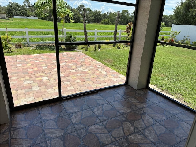 interior space featuring stone finish floor and a textured wall