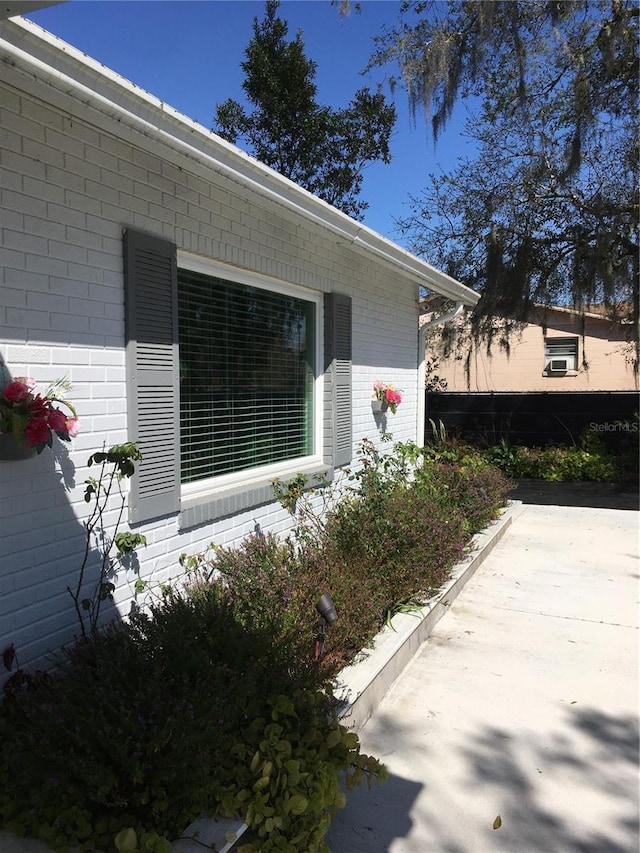 view of property exterior with brick siding