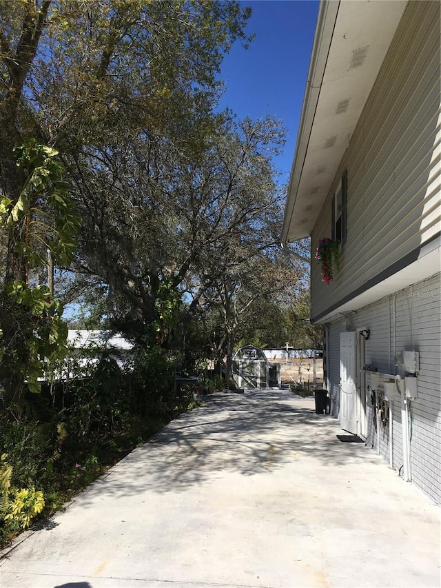 view of side of property featuring a patio