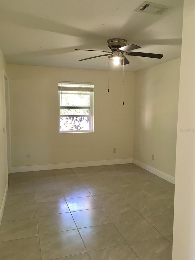 unfurnished room featuring visible vents, baseboards, and light tile patterned floors