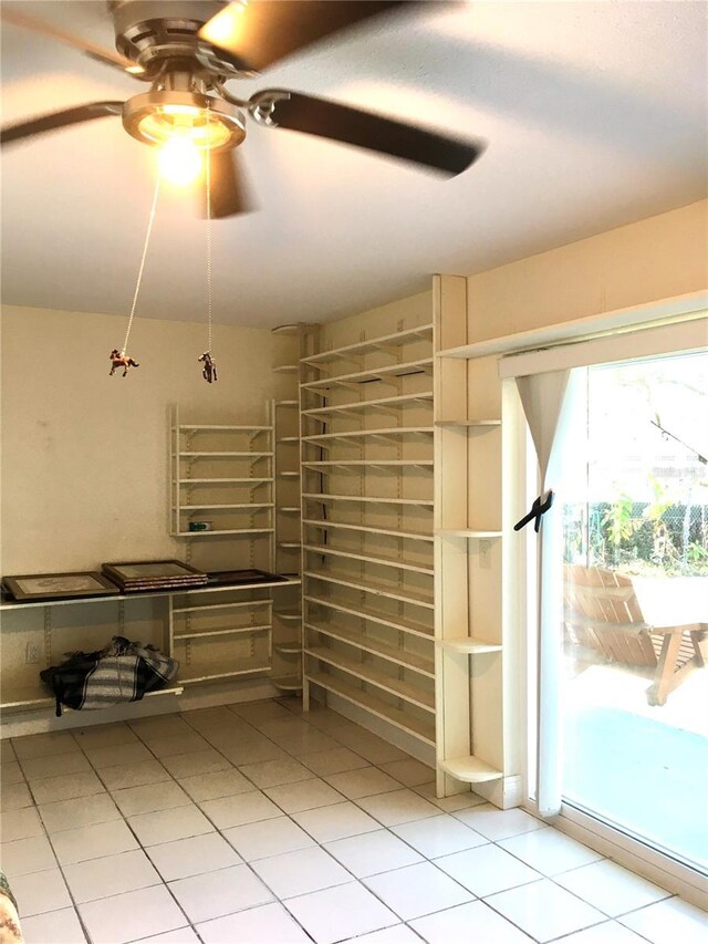 interior space with ceiling fan and baseboard heating