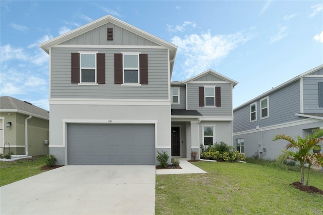 view of front facade featuring driveway, an attached garage, board and batten siding, and a front yard