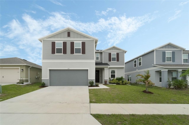 view of front of house with board and batten siding, a front yard, driveway, and an attached garage