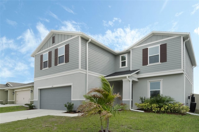 view of front of house featuring concrete driveway, an attached garage, a front yard, board and batten siding, and stucco siding